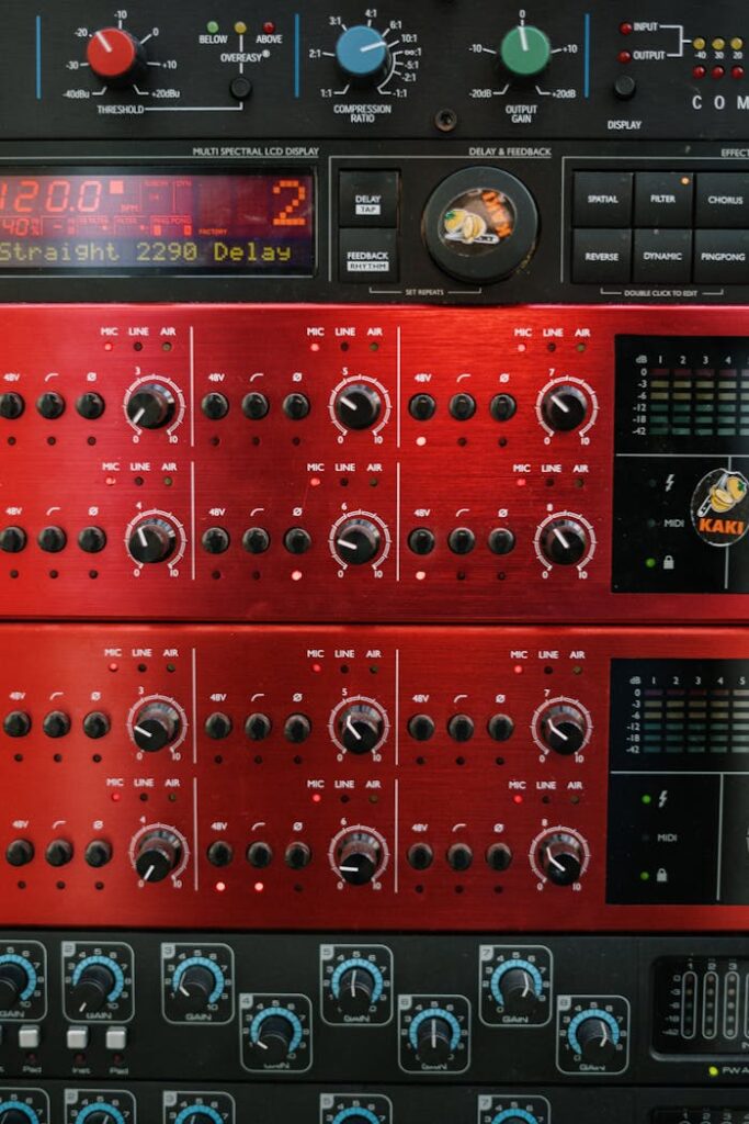 pexels-photo-4088009 A detailed view of professional audio equipment in a music studio focusing on control panels and dials.